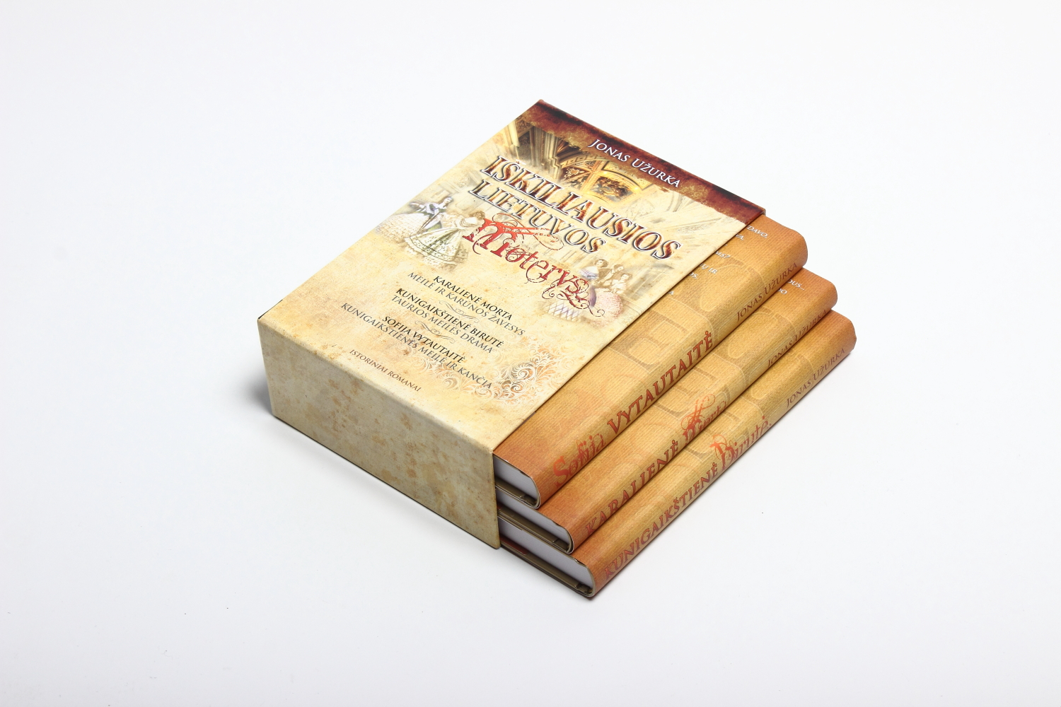 Parchment-style book slipcase with historical motifs, holding three books