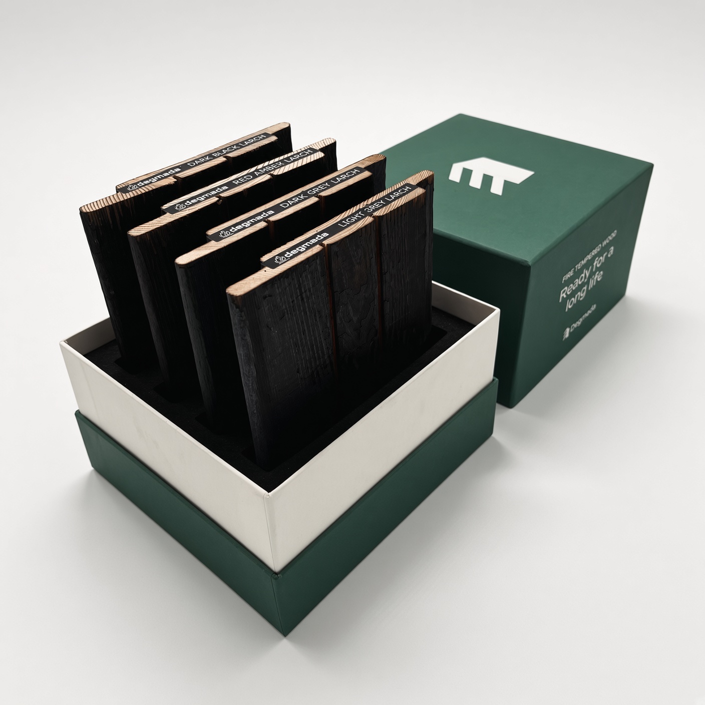 Green and white lid-and-base box with samples