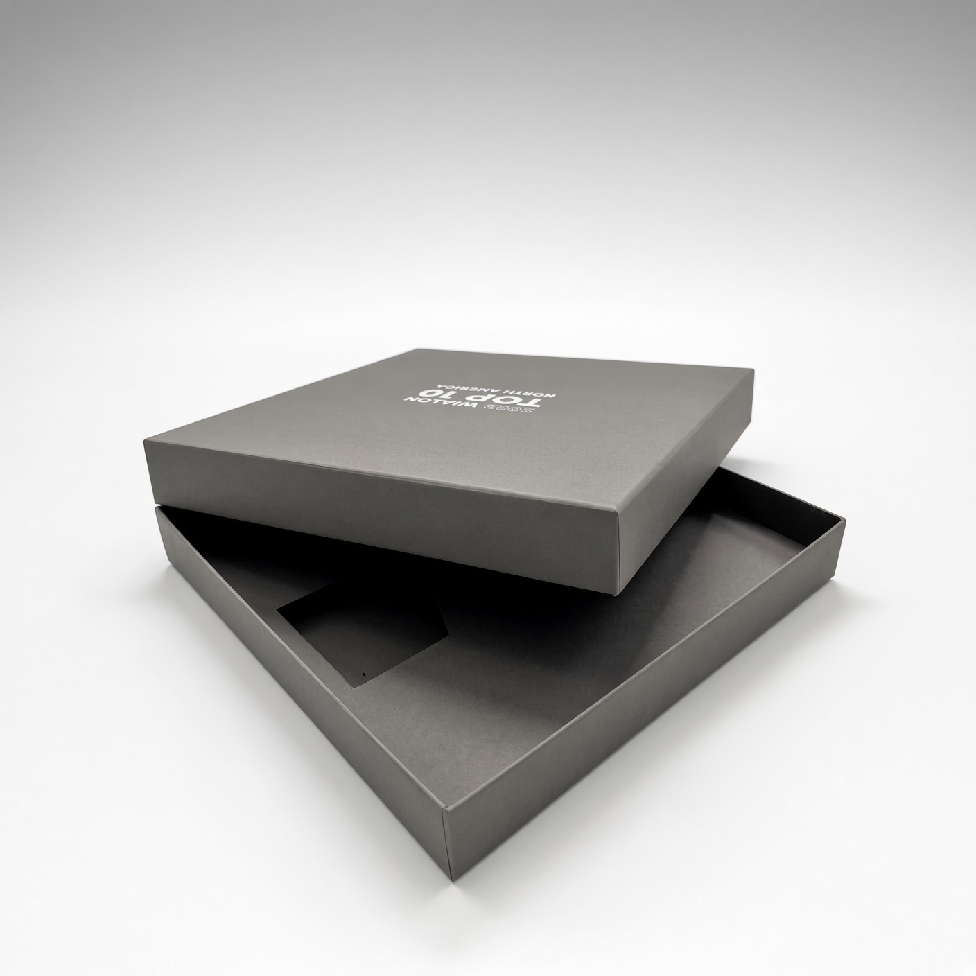 Grey rigid lid-and-base box with a logo