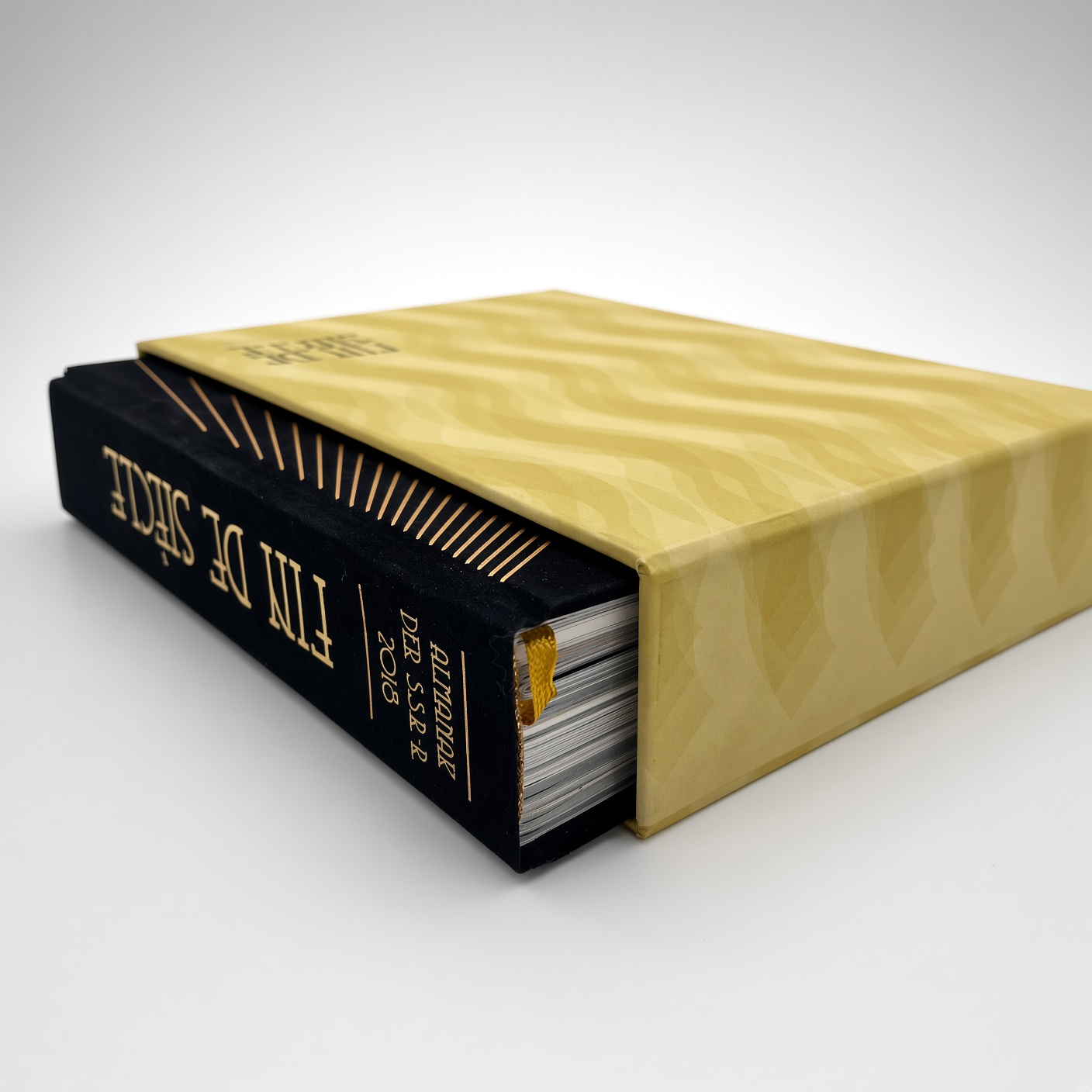 Gold rigid book slipcase with a black hardcover book