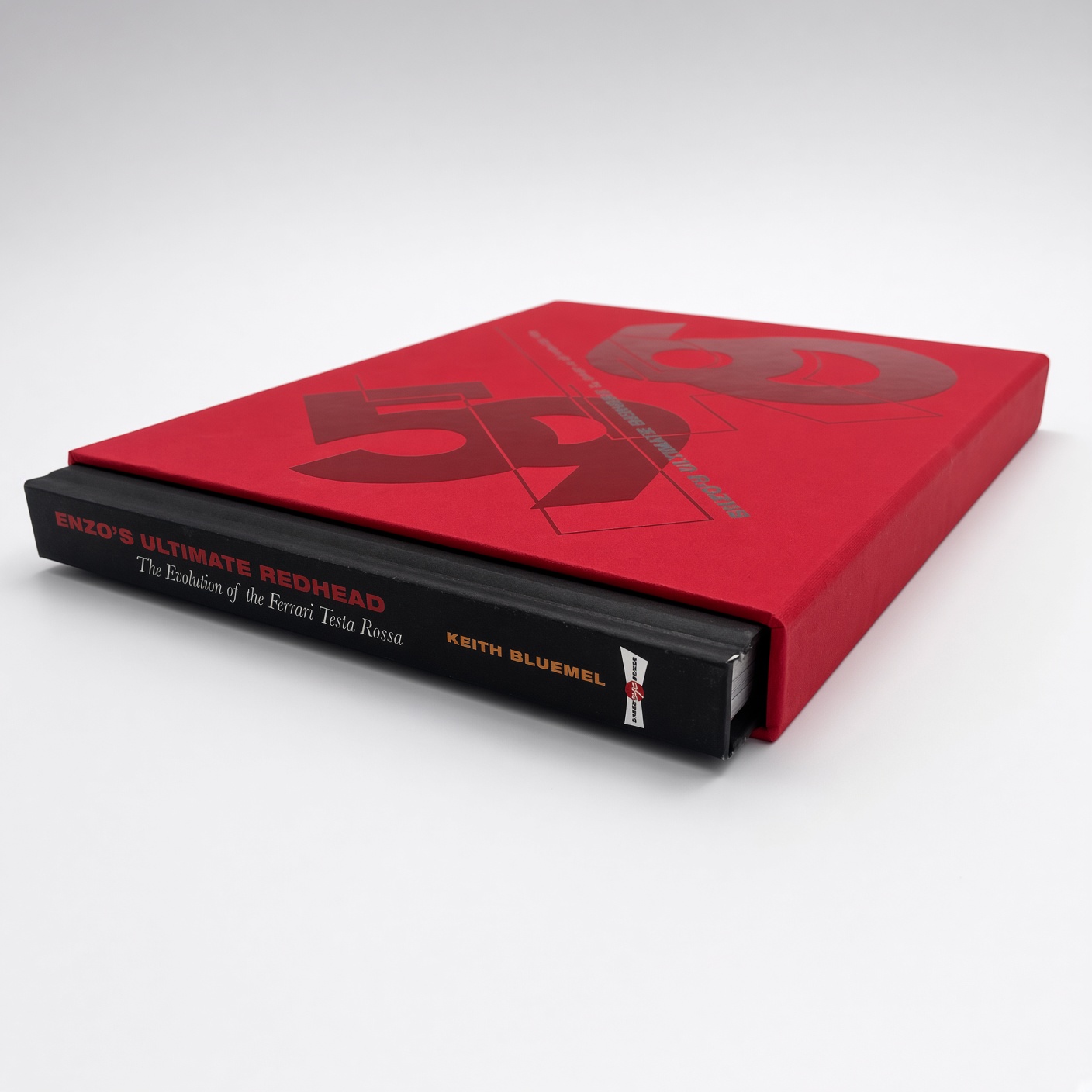 Red book slipcase with embossing and a book inside