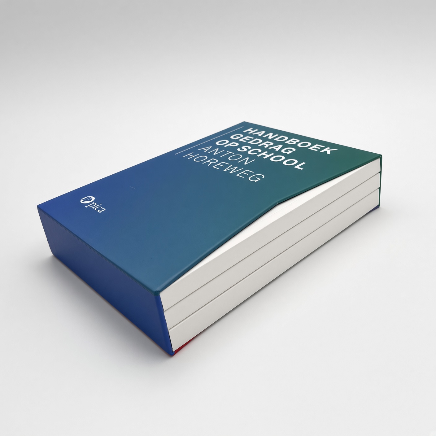 Blue-green slipcase holding two books