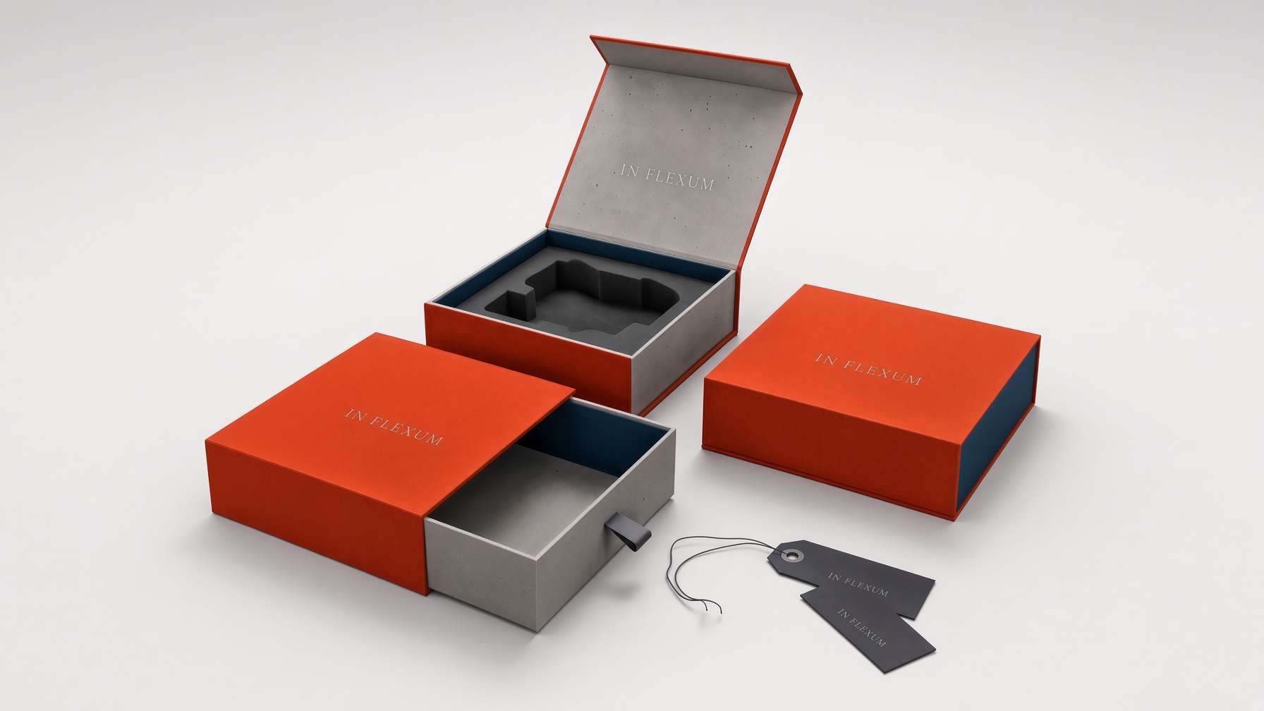 Orange rigid boxes: a sliding drawer box and a hinged-lid box with a grey insert, with hang tags alongside